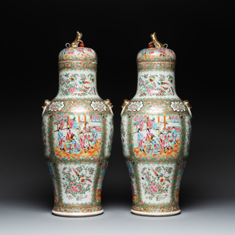 A pair of Chinese Canton famille rose vases and covers with narrative design, 19th C.