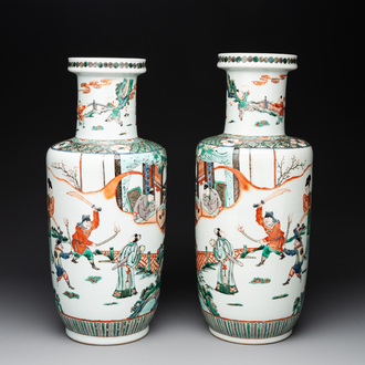 A pair of Chinese famille verte rouleau vases with narrative design, 19th C.