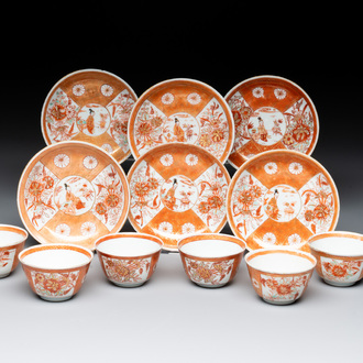 Six Chinese gilt-decorated iron-red cups and saucers with figural design, Yongzheng
