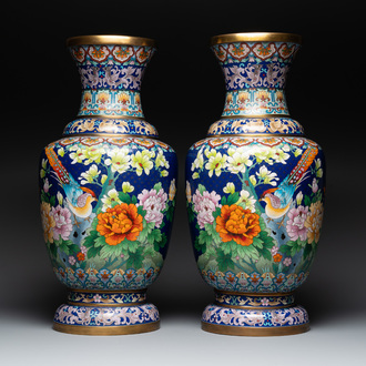 A pair of large Chinese cloisonné vases with birds among flowering branches, 20th C.