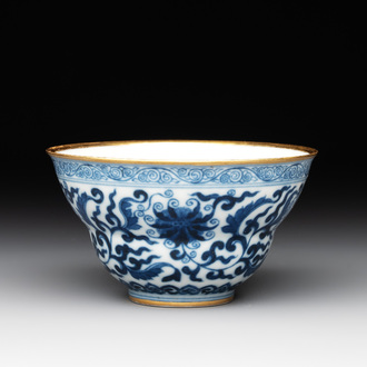 A Chinese gilt-decorated blue and white 'lotus scroll' bowl, Daoguang mark and of the period