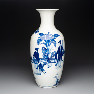 A Chinese blue and white vase with ladies and playing boys in a garden, 19th C.