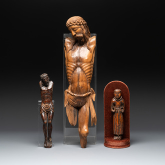 Two carved wooden Corpi Christi and a figure of a monk, Spain and Goa, 16th C.