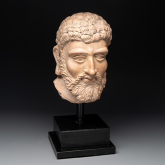 A large terracotta head of a bearded man, Gandhara region, Kushan period, 4/5th C.