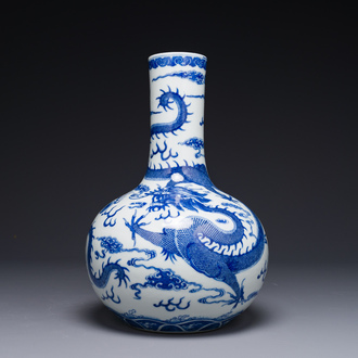 A Chinese blue and white 'dragon' bottle vase, Yongzheng mark, 19th C.