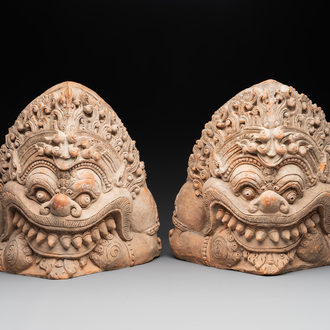 A pair of Cambodian terracotta architectural ornaments depicting Kala, late Khmer period