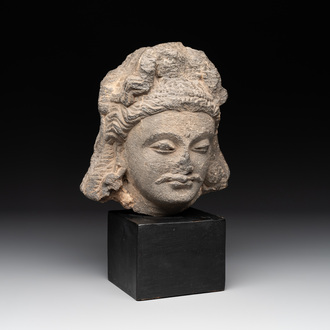 A Gandhara grey schist relief fragment of a Bodhisattva head, 2nd/3rd C.
