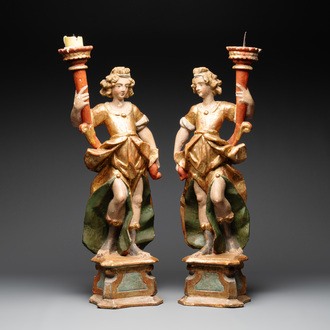 A pair of gilt and polychromed wooden angel-form candlesticks, Germany, 18/19th C.