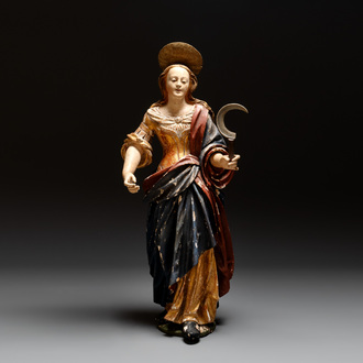 A large gilt and polychromed wooden sculpture of a female saint with a sickle, Germany, 18th C.