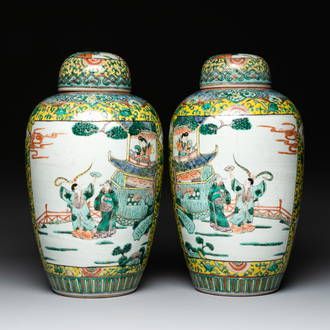 A pair of Chinese famille verte yellow-ground vases and covers with narrative design, 19th C.