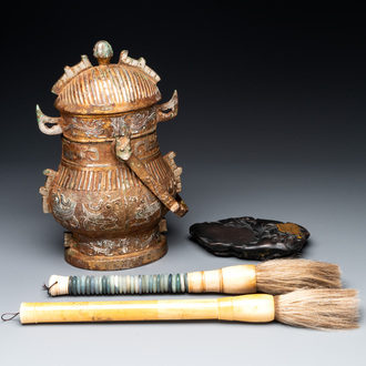 A Chinese archaistic bronze 'you 卣' vessel and cover, an inkstone and two calligraphy brushes, 20th C.