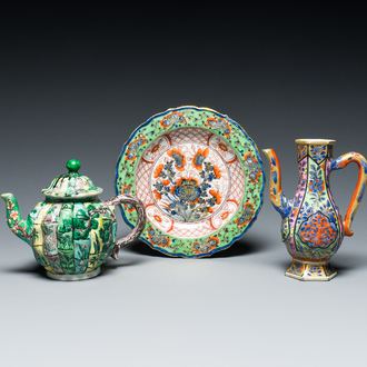 A Chinese verte biscuit teapot, a English-decorated blue and white plate and a ewer, Kangxi