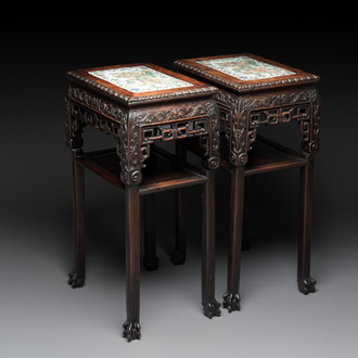 A pair of Chinese famille verte 'narrative' plaques mounted in hardwood tables, 19th C.