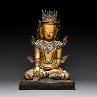 A very large Burmese mica-inlaid gilt-lacquered wooden Buddha, 19th C.