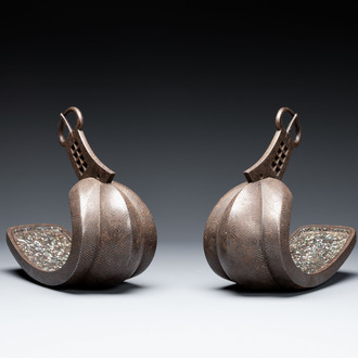 A pair of Japanese steel 'abumi' stirrups with silver and mother-of-pearl-inlay, Edo, 18/19th C.