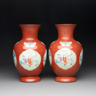 A pair of Chinese famille rose coral-red-ground vases with playing boys, 18/19th C.