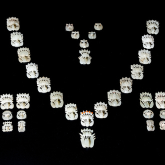 34 Chinese white and celadon jade phoenix-form hat ornaments, 19th C.