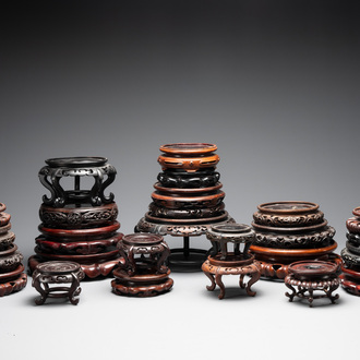 A collection of 26 Chinese wooden stands, 19/20th C.