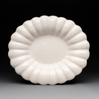 A rare gadrooned oval white Delftware dish, 17th C.
