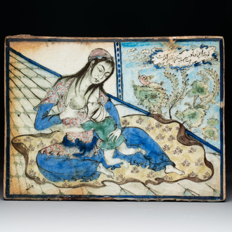 A polychrome Qajar pottery 'breastfeeding' tile, Iran, 19th C.