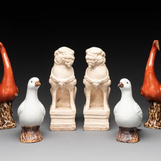 A pair of Chinese white-glazed Buddhist lions, a pair of doves and a pair of iron-red-decorated cranes, Ming and later