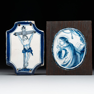 A rare small blue and white Dutch Delft 'Crucifixion' plaque and a 'Mary Magdalene' medallion, 18th C.