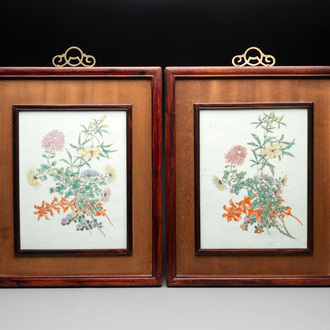 A pair of Chinese famille rose plaques in wooden frames, 20th C.