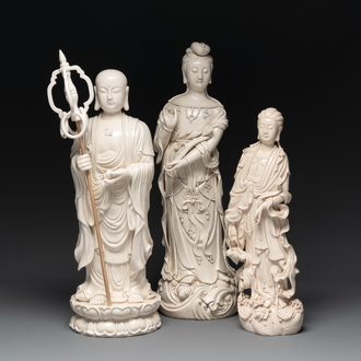 Three Chinese Dehua blanc de Chine figures of Guanyin and a monk, He Chaozong 何朝宗 and Dehua 德化 mark, 20th C.