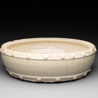 A large Chinese cream-glazed drum-shaped basin, Ming