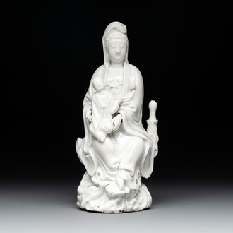 A Chinese Dehua blanc de Chine figure of Guanyin with a boy, Kangxi/Qianlong