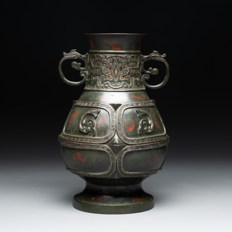 A Chinese archaistic gold- and silver-inlaid bronze vase with pseudo-rust patina, 19th C.