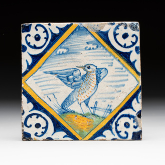 A fine polychrome Dutch Delft maiolica 'bird' diamond tile with a trial drawing on the back, late 16th C.