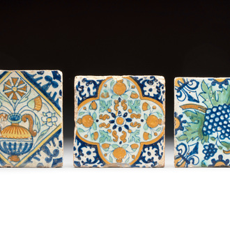 Three small polychrome Dutch Delft 'ornamental' and 'flower pot decor' tiles, early 17th C.