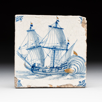 A blue and white Dutch Delft 'firing three-master' tile with coloured details, 17th C.