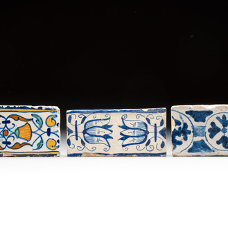 Two blue-white and one polychrome Dutch Delft 'border' 'ornamental' tiles, ca. 1600