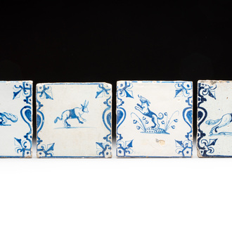 Four blue and white Dutch Delft 'animals' 'candelabra' tiles, 17th C.