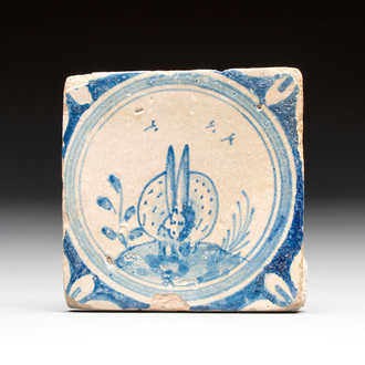 A small blue and white Dutch Delft 'rabbit' medallion tile, late 16th C.