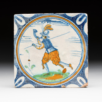 A polychrome Dutch Delft maiolica 'horn blower' medallion tile, late 16th C.