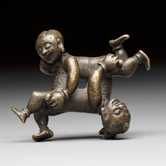 A Chinese bronze scroll weight in shape of two boys, Qing