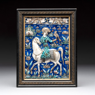 A rectangular Qajar relief-moulded tile with a prince on horseback, Iran, 19th C.