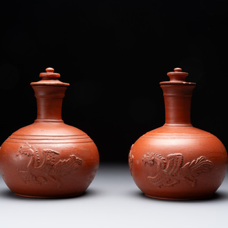 A pair of Yixing-style 'phoenix' bottle vases and covers, possibly England, 18th C.