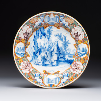 A fine polychrome Dutch Delft mixed technique 'The Faith of the Caanite Woman' plate, 18th C.