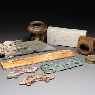A varied collection of nine Chinese archaistic jade and stone carvings, 20th C.