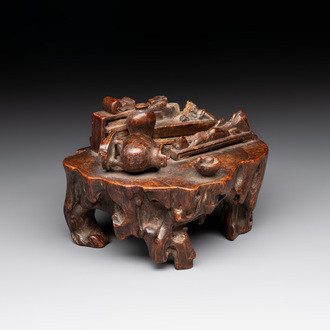 A Chinese agarwood carving of a miniature table with antiquities, 18/19th C.