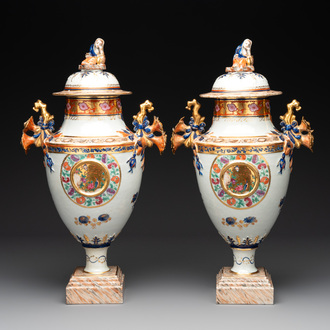 A pair of Chinese export famille rose urns and covers, Qianlong