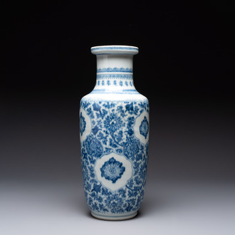 A Chinese blue and white 'flower scrolls' rouleau vase, Kangxi