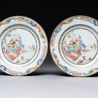 A fine pair of Chinese gilt-decorated famille rose 'Autumn' plates with troubadours, Qianlong