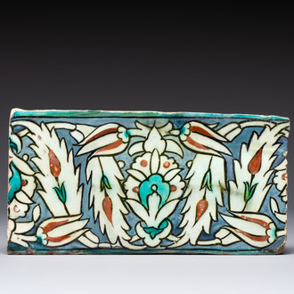 A polychrome Iznik-style Damascus pottery frieze tile with floral design, 17/18th C.