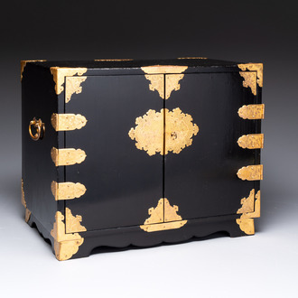 A rare Japanese black-lacquered cabinet with finely engraved gilt mounts, Edo, late 17th C.