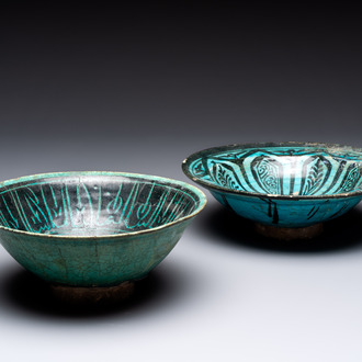 Two turquoise-and-black-glazed bowls, Kashan, 13/14th C.
